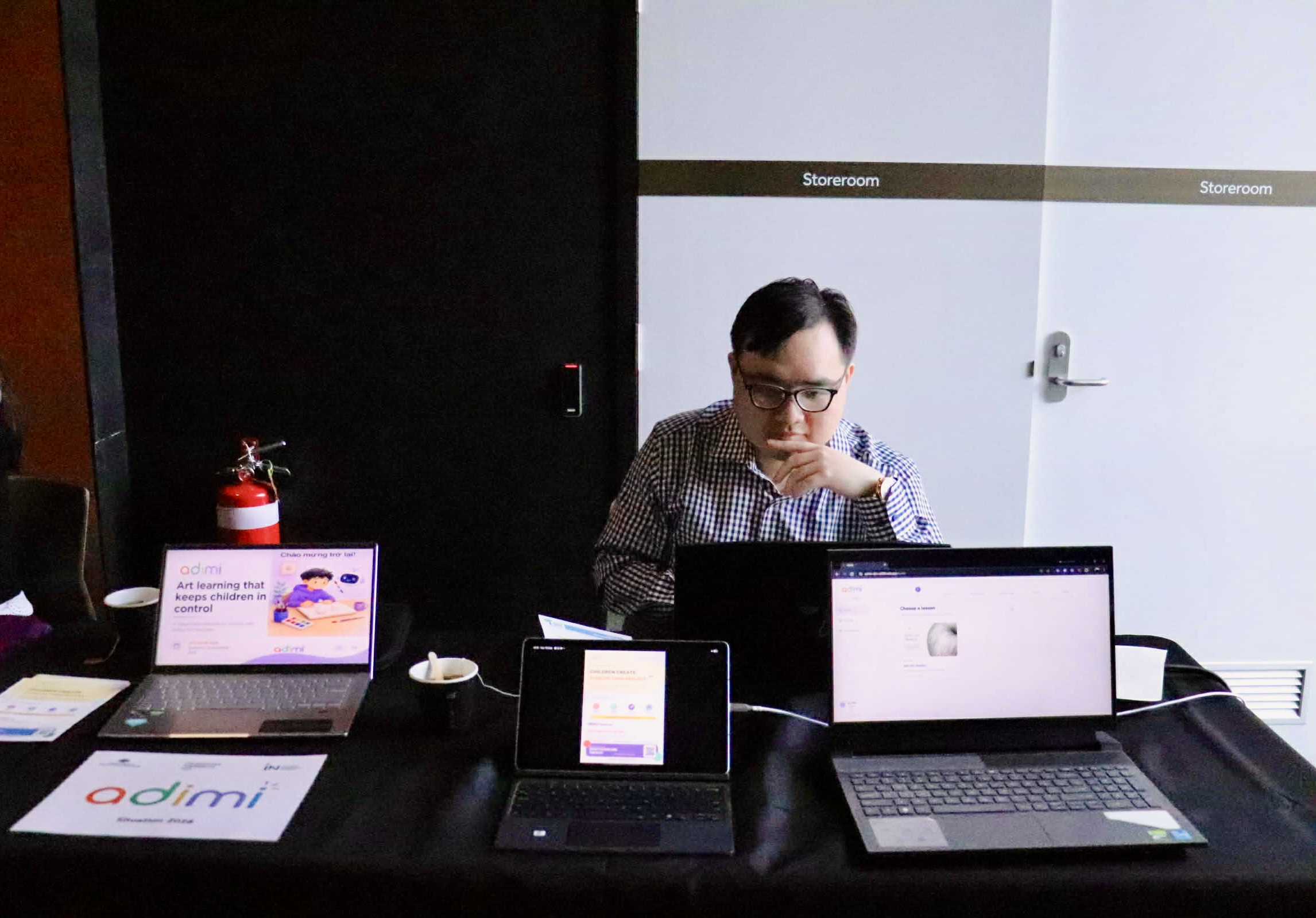 Adimi product demo running on laptops at the booth